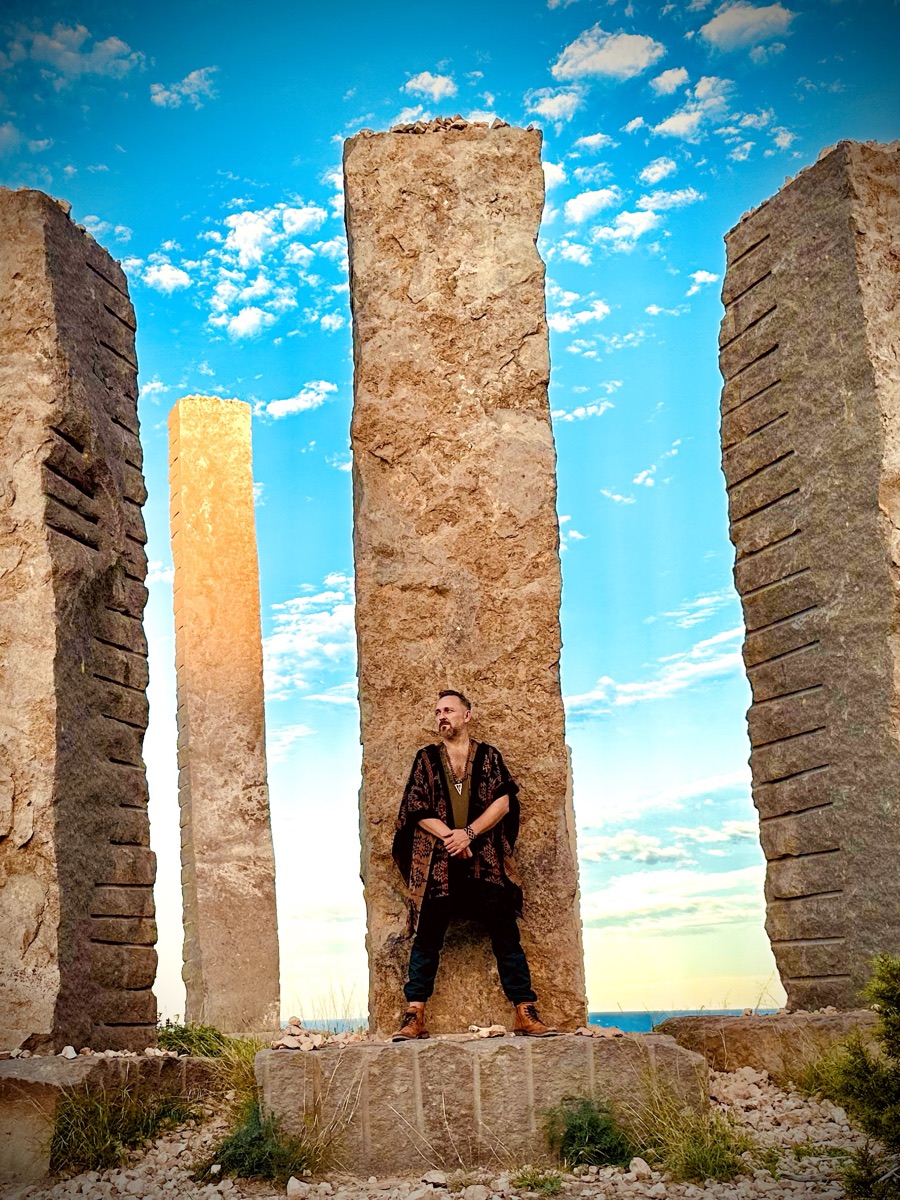 Xaguar at a standing stone pillar, Time & Space, Ibiza